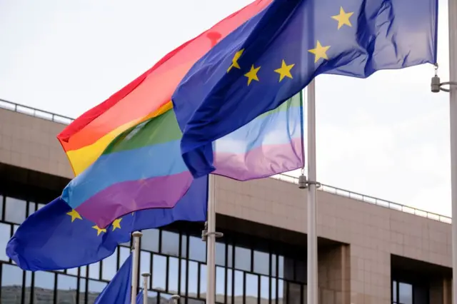 BRUSSELS, BELGIUM - MAY 17: The Rainbow flag (LGBT movement) and the EU flags are seen in front of the Berlaymont, the EU Commission headquarter in Brussels, Belgium, 17 May 2023. (Photo by Thierry Monasse/Getty Images)