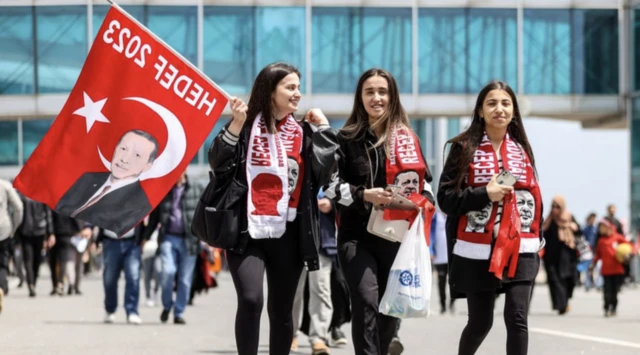 Erdogan supporters fly the flag for their leader