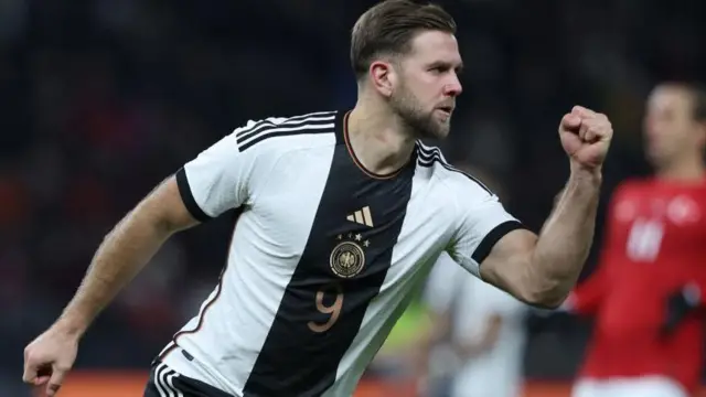 Niclas Fullkrug celebrating scoring a goal for Germany