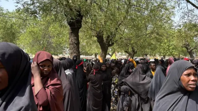 Women wey wear black dress and red scarf mark International Quds Day Procession for Kano