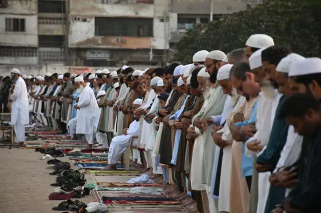 akistani Muslims gather to perform the Eid Al-Adha prayer at Eidgah Ground in Karachi, Pakistan on June 07, 2025. (
