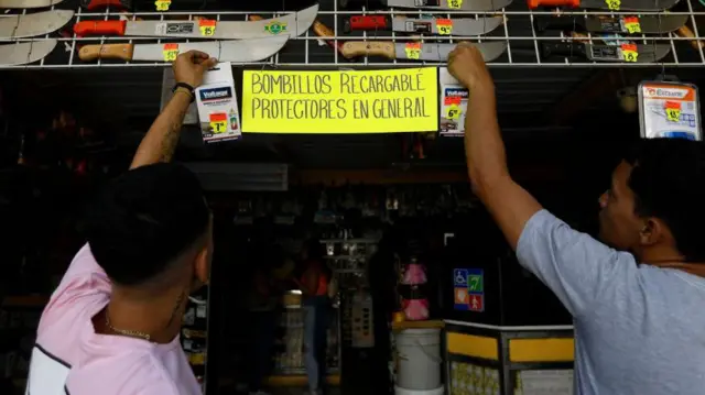 Rechargeable light bulb sellers in Caracas. 