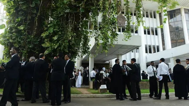 Sri Lankan lawyers protest outside the High Court in Colombo on December 12, 2012. Lawyers staged the token one-day protest to denounce government moves to impeach Chief Justice Shriani Bandaranayake after she scuttled several bills that would have given more powers to the ruling party