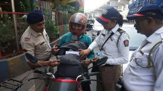 People ready to welcome the new year backdrop of new year. Mumbai Police are seen Checking vehicles entering Mumbai at Mumbai Entry Point Mulund Toll Naka , in Thane, on December 31, 2024 in Mumbai, India.