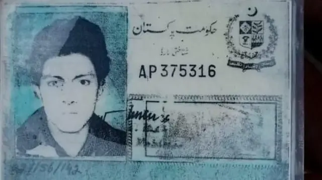 Identification card with blurred protrait photo and faded print