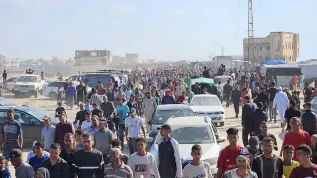 A file picture shows people seeking aid at the Gaza Humanitarian Foundation distribution point in Rafah on Tuesday