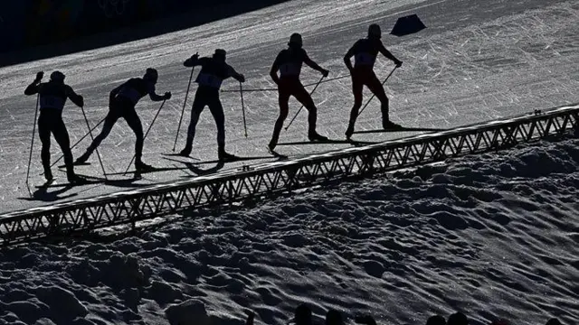 Лижники на стадіоні в Тезеро