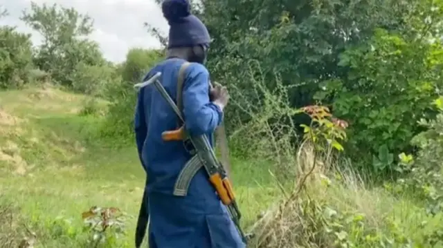 One man hold gun and cover im face