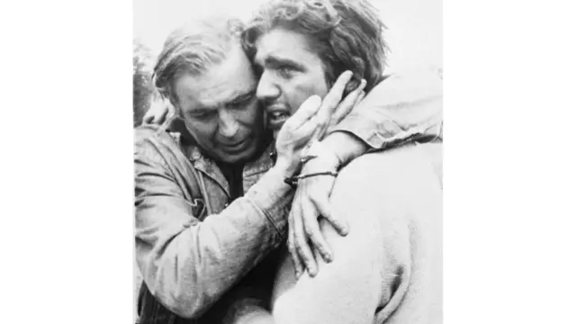 Survivor Carlos Paez pictured being reunited with his father 