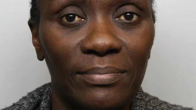 A police mugshot of Lydia Mugambe