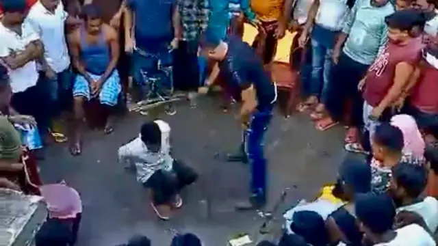 ভাইরাল হওয়া ভিডিওতে দেখা যাচ্ছে তাজিমুল ইসলাম এক যুবককে লাঠি দিয়ে মারছেন