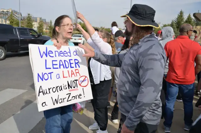 Protesters and supporters of former President Donald J. Trump speak outside the Gaylord Rockies Resort and Convention Center in Aurora ahead of a Trump campaign rally on Oct. 11, 2024. (Photo by Hyoung Chang/MediaNews Group/The Denver Post via Getty Images)