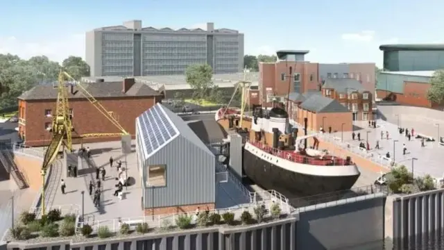 Dibujo artístico de un gran barco negro atracado junto a un edificio plateado. Hay gente caminando por las aceras a ambos lados y un gran edificio de varias plantas domina el horizonte al fondo.