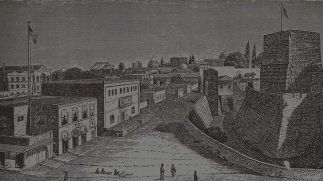 مبنى القنصلية الأمريكية الموجود على اليسار ويرفرف فوقها العلم الأمريكي، مقابل قلعة القدس التي تعرف حالياً بـ"برج داوود"