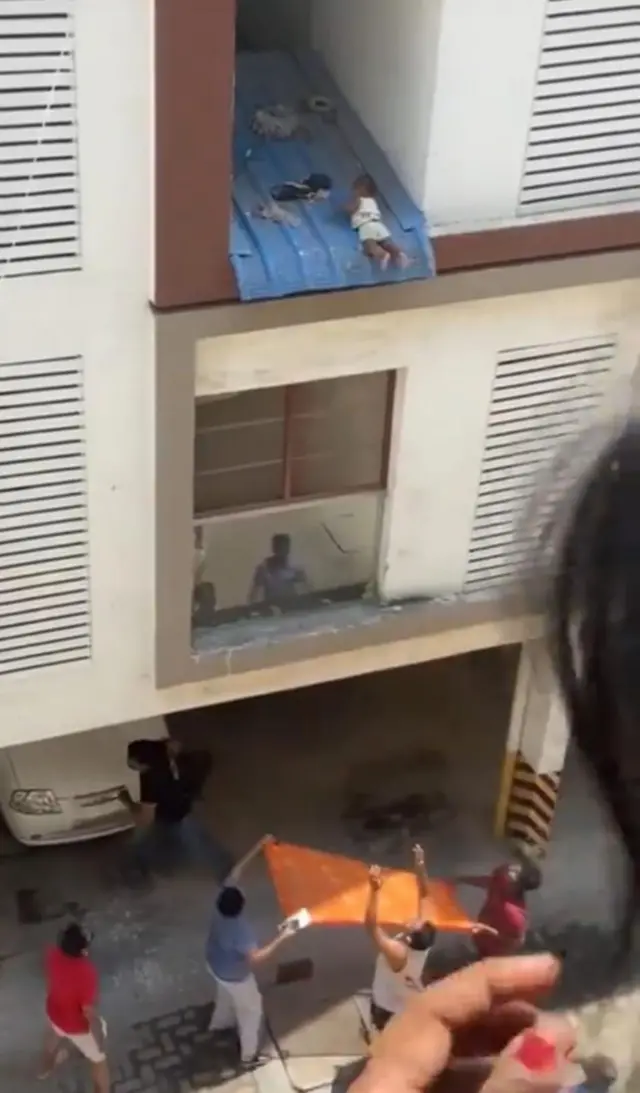 மாடியில் இருந்து மீட்கப்பட்ட குழந்தை; தாயின் உயிரை பறித்த சமூக வலைதள பதிவுகள்!