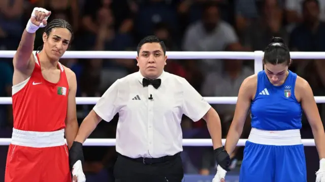 Algeria's Imane Khelif (in red) during the Women's 66kg preliminary round match against Angela Carini of Italy (in blue) on day six of the Olympic Games Paris 2024.