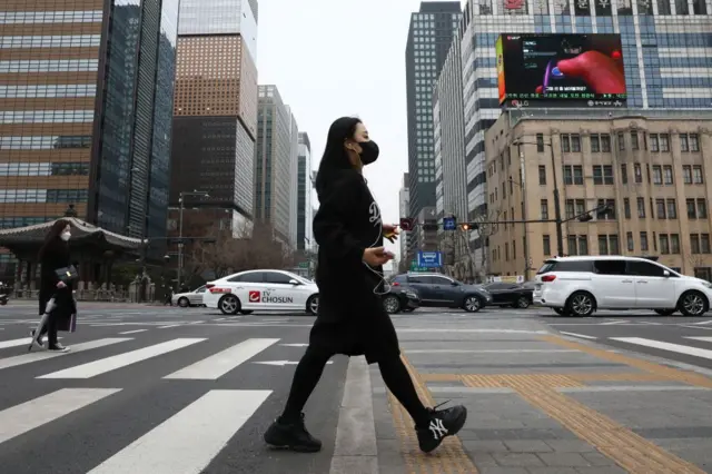 MARCH 17: People walk along the street on March 17, 2022 in Seoul, South Korea.