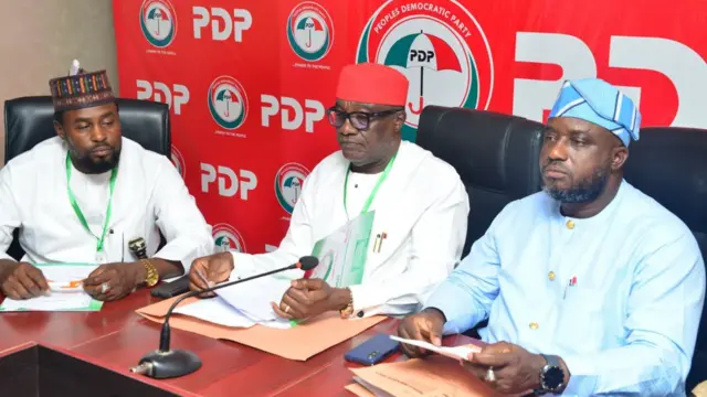 Three PDP members wey dey loyal to di FCT minister Nyesom Wike during one meeting for Abuja