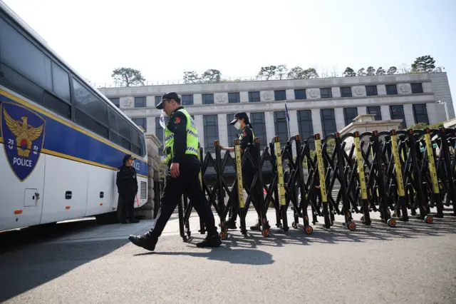 Police officers set a barricade at the Constitutional Court ahead of an impeachment ruling in Seoul, South Korea, April 3, 2025