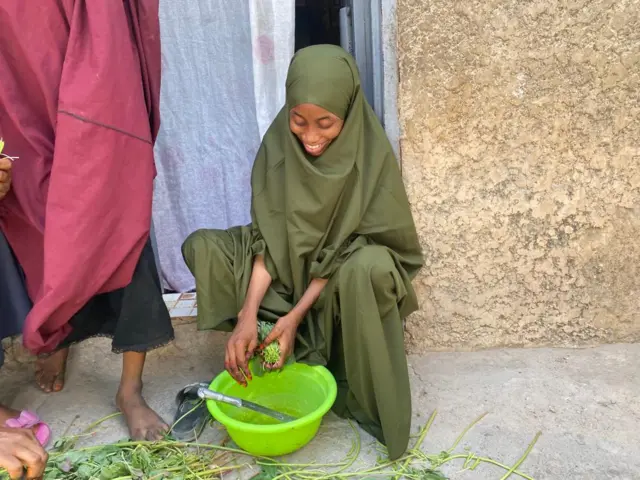 Fatima doing some chores for house