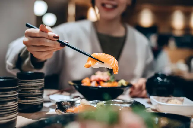 A person eating sushi