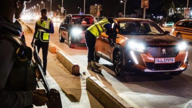 Interpol officers on an inspection of cars in the operation at night