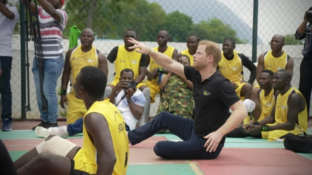Prince Harry play volleyball with wounded soldiers