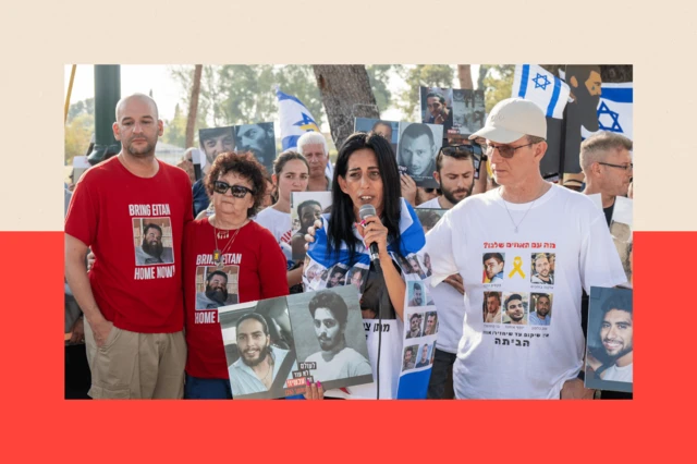 Former hostages and families of the hostages hold placards and wear tshirts with the faces of their loved ones