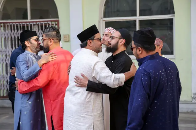 KATHMANDU, NEPAL-JUNE 7: Nepalese Muslim greet each other after performing Eid prayer to mark the Eid al-Adha