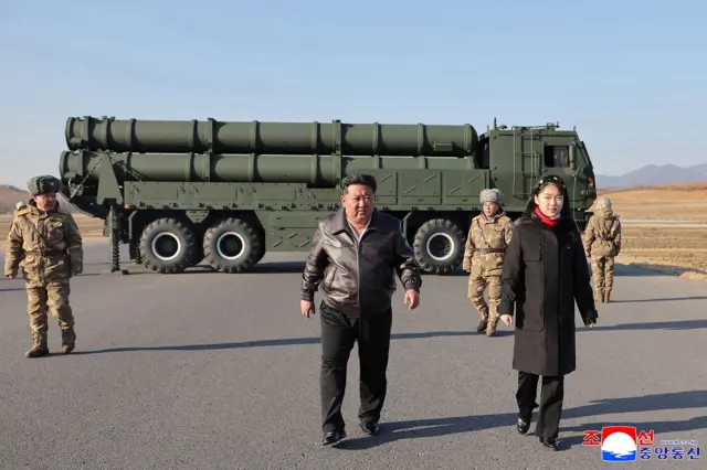 This picture taken on January 27, 2026 and released by North Korea's official Korean Central News Agency (KCNA) on January 28, 2026 shows North Korean leader Kim Jong Un (C) and his daughter Kim Ju Ae (2nd L) inspecting a test firing of the renewed large-caliber rocket launcher system, at an undisclosed location in North Korea.