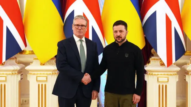 British Prime Minister Keir Starmer and Ukrainian President Volodymyr Zelensky shake hands at the start of their bilateral talks at Mariinskyi Palace on January 16, 2025 in Kyiv, Ukraine