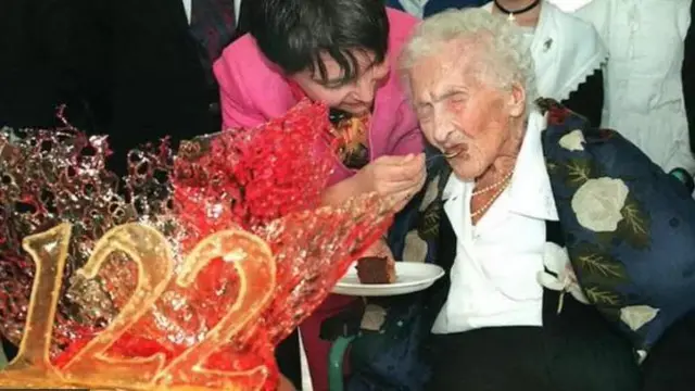 Jeanne Calmet being fed cake on her 122nd birthday in 1997