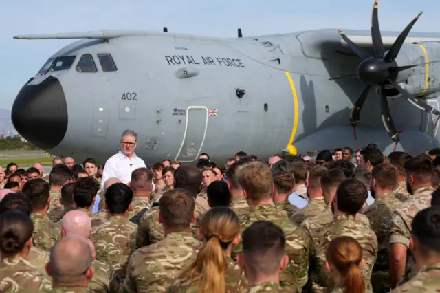 Britain's Prime Minister Keir Starmer speaks to soldiers at the RAF base in Akrotiri on the southern coast of Cyprus on December 10, 2024.