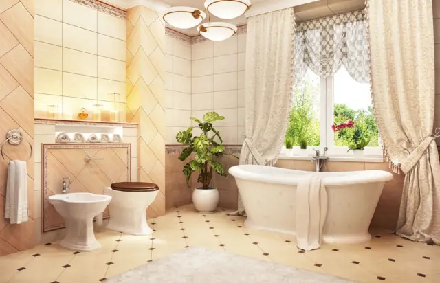 Bir banyo, sarı mermerler, tuvalet, bidet ve küvet var