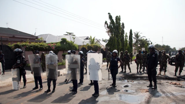 police and soldiers ready in waiting for election protest/confrontation