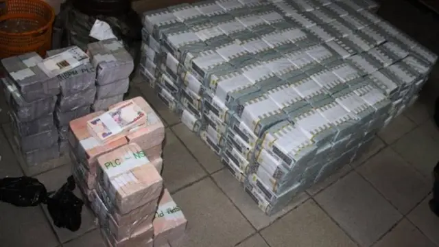 Photo of bundles of dollars discovered in a Lagos flat by the EFCC