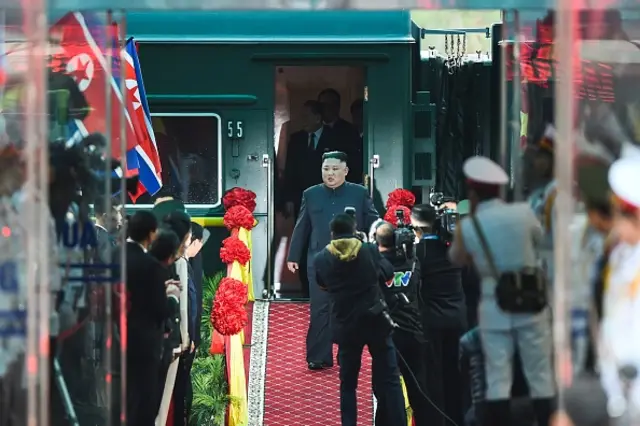 North Korea's leader Kim Jong Un (C) arrives at the Dong Dang railway station in Dong Dang, Lang Son province