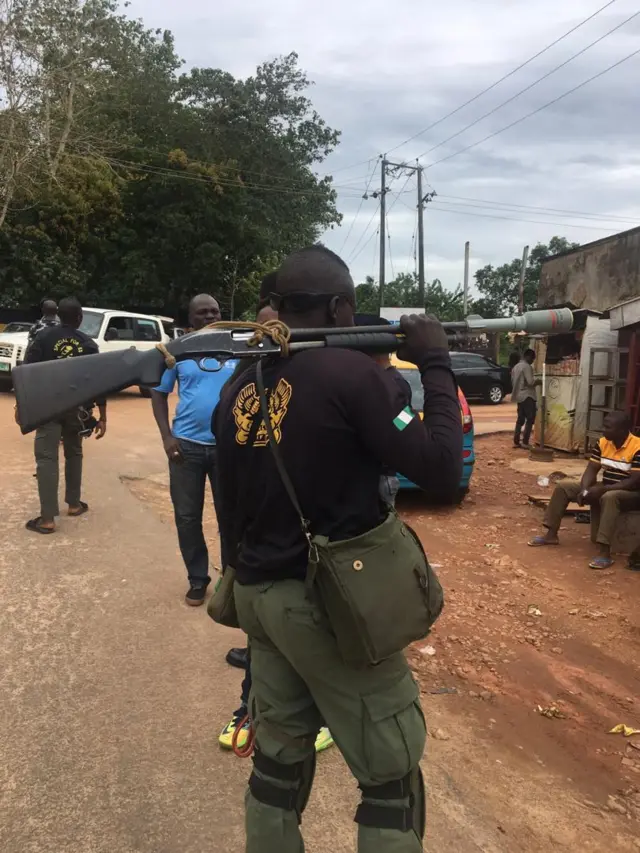 Officer with tear gas launcher
