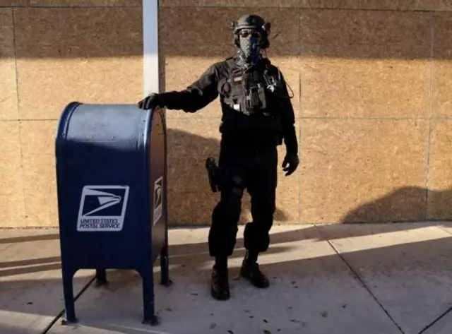 Seucrity agent stand wit ballot box