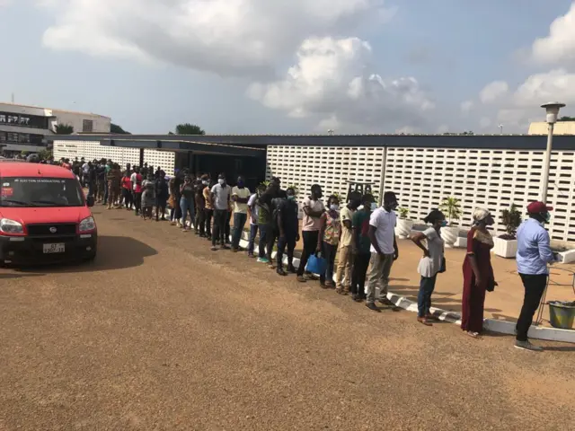 Ghana essential workers queue to vote