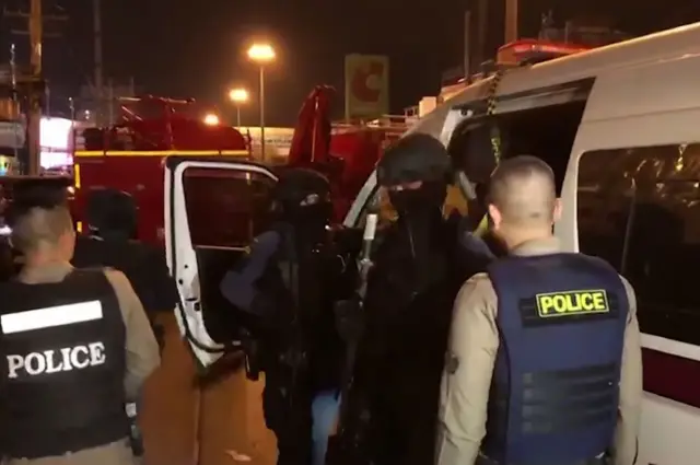 handout video released by the MCOT Thai Public Company Limited shows Thai police arriving at the scene of a mass shooting in the northeastern city of Nakhon Ratchasima