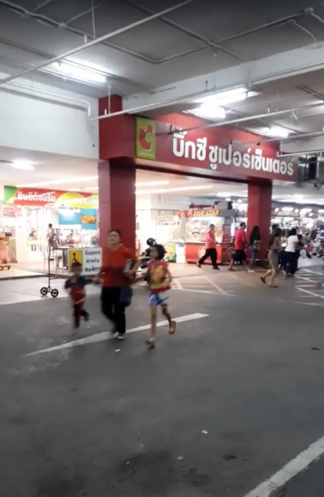 People run away from the shopping mall after a shooting rampage in the city of Nakhon Ratchasima, Thailand February 8, 2020,