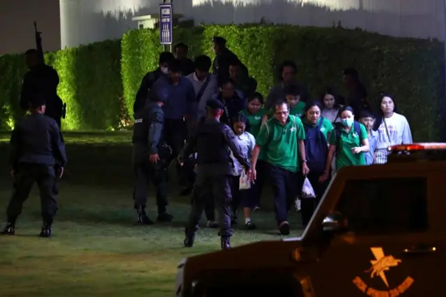Thailand security forces evacuated people from a shopping mall as they chase a shooter hidden in after a mass shooting in front of the Terminal 21