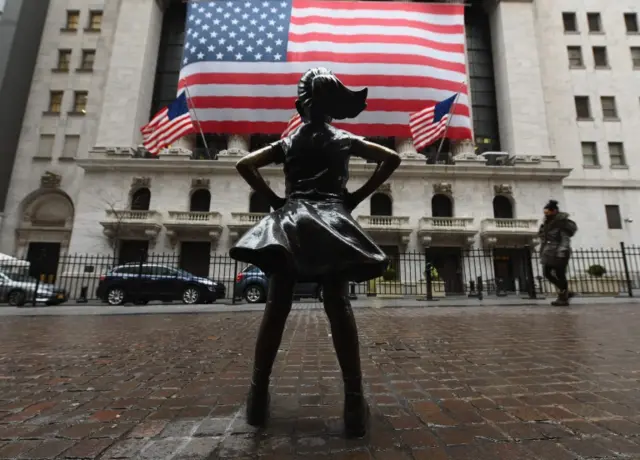 The Fearless Girl statue stands in front of the New York Stock Exchange near Wall Street