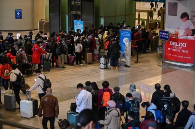 Chinese city at centre of outbreak eases restrictions