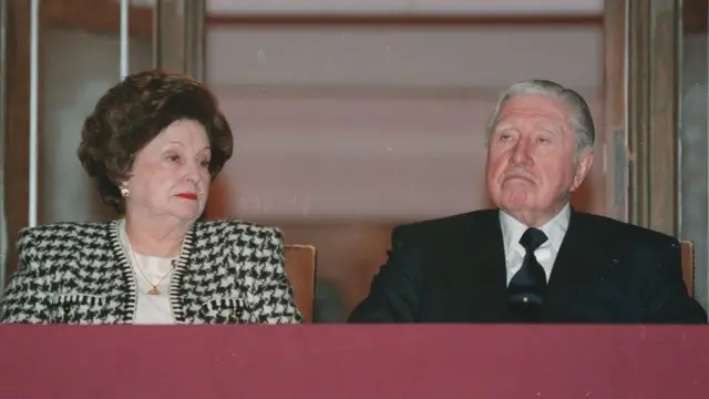 Pinochet, seen here alongside his wife in 2000, led a regime that killed and tortured thousands of people
