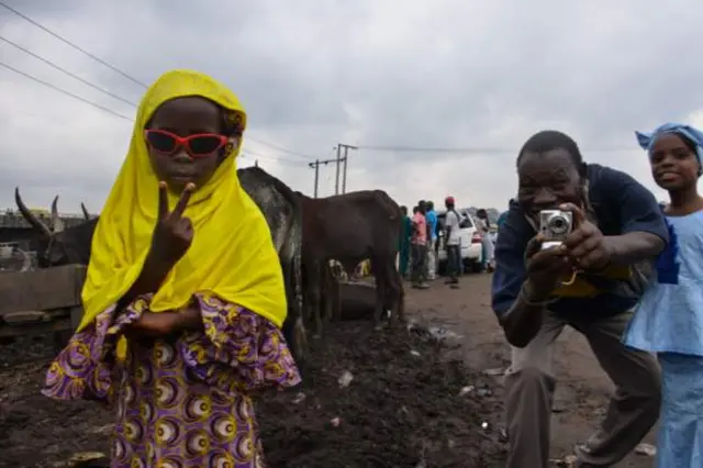 This girl posed for the camera after Eid al-Adha prayer at the Kara Cattle Market Mosque in Nigeria