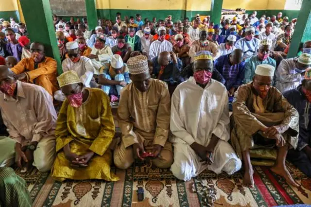 Worshippers attend prayers at a mosque in Guinea's capital city, Conakry