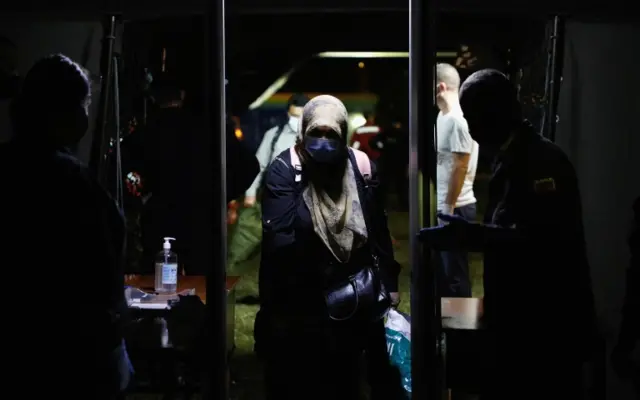 People who have been evacuated from Afghanistan arrive at Tirana International Airport, after Taliban insurgents entered Afghanistan"s capital Kabul, in Tirana, Albania, August 27, 2021. REUTERS/Florion Goga