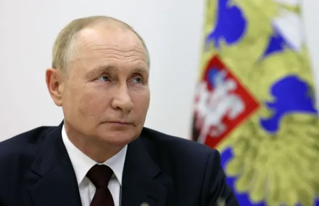 путін